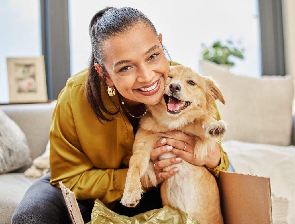 woman holding a pregnant dog